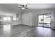 Open living room with grey floors and access to backyard at 2234 E 37Th Ave, Apache Junction, AZ 85119