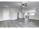 Open concept living room with grey floors and kitchen view at 2234 E 37Th Ave, Apache Junction, AZ 85119