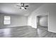 Spacious living area with grey floors and access to other rooms at 2234 E 37Th Ave, Apache Junction, AZ 85119