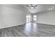 Spacious living room with wood-look floors and sliding glass doors at 2234 E 37Th Ave, Apache Junction, AZ 85119
