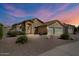 Charming single-story home with a two-car garage, neutral colors, and low-maintenance landscaping at 2234 E Stephens Rd, Gilbert, AZ 85296