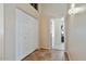 Hallway features tile flooring and a closet with bi-fold doors at 2234 E Stephens Rd, Gilbert, AZ 85296