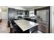 Modern kitchen with stainless steel appliances, a center island, and dark cabinetry at 2234 E Stephens Rd, Gilbert, AZ 85296