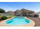 Private backyard pool with patio area, landscaping and views of the home exterior at 2234 E Stephens Rd, Gilbert, AZ 85296