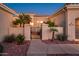 Elegant entry with gated courtyard, desert landscaping, and walkway at 22819 N Del Monte Dr, Sun City West, AZ 85375