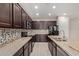 Modern kitchen with stainless steel appliances, granite countertops, and ample cabinet space at 2364 S Minneola Ln, Gilbert, AZ 85295