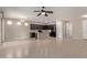 Open-concept kitchen and dining area with an island and dark wood cabinetry at 2364 S Minneola Ln, Gilbert, AZ 85295