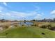 Picturesque golf course view with pond and manicured greens at 23833 S Stoney Path Dr, Sun Lakes, AZ 85248