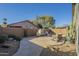 Cozy backyard featuring lounge seating, cacti, and a stone paver patio at 2701 E Anderson Dr, Phoenix, AZ 85032