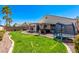Large backyard with a grassy area, hot tub, and trampoline at 29127 N Mountain View Rd, San Tan Valley, AZ 85143