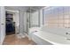 Bathroom with shower, bathtub and walk-in closet at 29127 N Mountain View Rd, San Tan Valley, AZ 85143