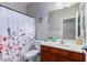 Bathroom with single vanity and floral shower curtain at 29127 N Mountain View Rd, San Tan Valley, AZ 85143