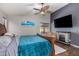 Spacious main bedroom with fireplace, large TV, and walk-in closet at 29127 N Mountain View Rd, San Tan Valley, AZ 85143