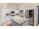 Modern kitchen featuring white cabinets and a large island at 29127 N Mountain View Rd, San Tan Valley, AZ 85143