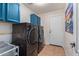 Laundry room with washer, dryer, and extra storage at 29127 N Mountain View Rd, San Tan Valley, AZ 85143