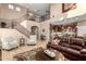 High-ceiling living room with staircase to the second floor and view of kitchen at 3057 E Trigger Way, Gilbert, AZ 85297