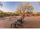 Patio with a table and chairs, and natural desert landscaping at 38860 N School House Rd, Cave Creek, AZ 85331