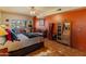 Bedroom featuring vibrant colors, a ceiling fan, tile flooring, and unique decor at 38860 N School House Rd, Cave Creek, AZ 85331