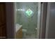 Bathroom featuring a marble vanity and glass shower with decorative art at 4119 E Glencove St, Mesa, AZ 85205
