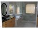Bright bathroom with soaking tub and a glass shower at 4119 E Glencove St, Mesa, AZ 85205