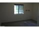 Minimal bedroom featuring carpeted floors and a window providing ample natural light at 4119 E Glencove St, Mesa, AZ 85205