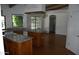 Bright kitchen with an island, light wood cabinets, granite counters, and wood floors at 4119 E Glencove St, Mesa, AZ 85205