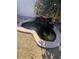 Backyard features peaceful pond with rock accents and natural foliage at 4119 E Glencove St, Mesa, AZ 85205