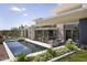 Modern home featuring a pool, covered patio, and outdoor lounge area perfect for entertaining at 4451 E Joshua Tree Ln, Paradise Valley, AZ 85253