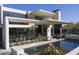 Modern backyard featuring a pool, desert landscaping, and mountain views for luxurious living at 4451 E Joshua Tree Ln, Paradise Valley, AZ 85253