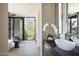 Modern bathroom with a sleek vanity, luxurious fixtures, and a separate shower at 4451 E Joshua Tree Ln, Paradise Valley, AZ 85253