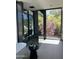 Bright bathroom with glass shower, soaking tub and a large window overlooking landscaped yard at 4451 E Joshua Tree Ln, Paradise Valley, AZ 85253