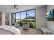 This bedroom offers views of the desert landscaped backyard and mountains at 4451 E Joshua Tree Ln, Paradise Valley, AZ 85253