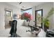 Bright exercise room with stationary bike, weight bench, TV and large window at 4451 E Joshua Tree Ln, Paradise Valley, AZ 85253