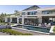 Modern home with a sleek pool, outdoor seating, desert landscaping, and a view of the mountains at 4451 E Joshua Tree Ln, Paradise Valley, AZ 85253