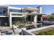 Beautifully landscaped modern home with a luxurious pool and outdoor living space at 4451 E Joshua Tree Ln, Paradise Valley, AZ 85253