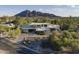 Contemporary home showcasing modern architecture and desert landscaping with mountain views at 4451 E Joshua Tree Ln, Paradise Valley, AZ 85253