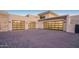 Spacious three-car garage with modern doors and ample parking on a paved driveway at 4451 E Joshua Tree Ln, Paradise Valley, AZ 85253