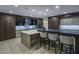 Modern kitchen featuring an island with seating, and sleek cabinetry at 4451 E Joshua Tree Ln, Paradise Valley, AZ 85253
