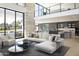 Open living space with high ceilings, modern decor, and seamless connection to dining area at 4451 E Joshua Tree Ln, Paradise Valley, AZ 85253