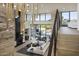 Living area with fireplace and floor to ceiling windows at 4451 E Joshua Tree Ln, Paradise Valley, AZ 85253
