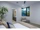 Bright bedroom with queen bed and ensuite bath featuring large window with seating at 4451 E Joshua Tree Ln, Paradise Valley, AZ 85253