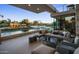 Relaxing outdoor patio with comfortable seating, fountain features and lush landscaping at 4451 E Joshua Tree Ln, Paradise Valley, AZ 85253