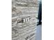 Travertine wall with integrated smart home control buttons and access to a bright room at 4451 E Joshua Tree Ln, Paradise Valley, AZ 85253