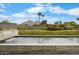 Beautiful water feature cascading into a pool with lush greenery and mountain views at 4451 E Joshua Tree Ln, Paradise Valley, AZ 85253