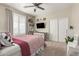 This bedroom features a ceiling fan and a window with shutter blinds at 4467 E Kelly Ct, Gilbert, AZ 85298