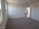 Bright bedroom with grey carpet and window at 48446 E Bruno Dr, Gold Canyon, AZ 85118