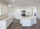 Modern kitchen with white cabinets and an island at 48446 E Bruno Dr, Gold Canyon, AZ 85118