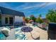 Inviting back yard with outdoor seating, art display, and an eye-catching colorful ground cover at 5674 N 12Th St, Phoenix, AZ 85014