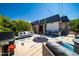 Inviting back yard with outdoor seating, art display, and an eye-catching colorful ground cover at 5674 N 12Th St, Phoenix, AZ 85014