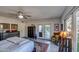 This bedroom features hardwood floors, an area rug, dresser, arm chair, and french doors at 5674 N 12Th St, Phoenix, AZ 85014